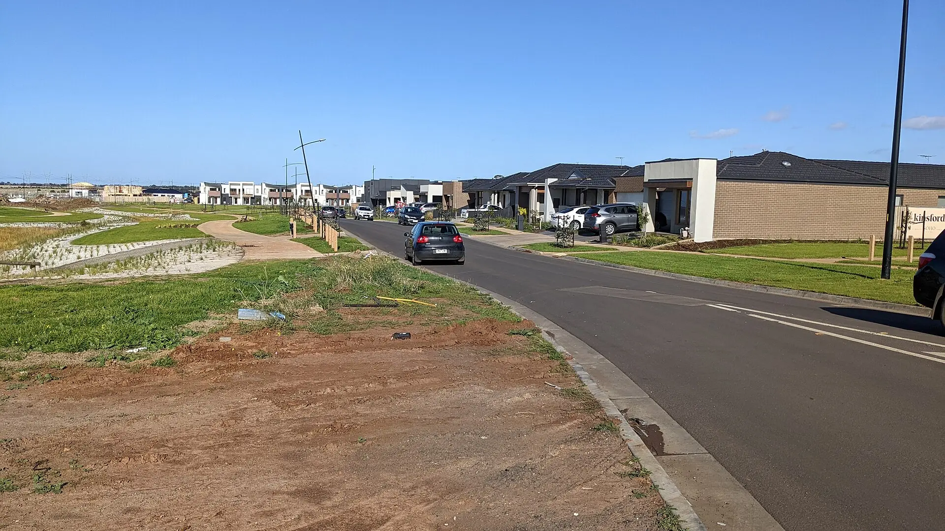 New housing estate subdivision with completed homes and vacant serviced lots